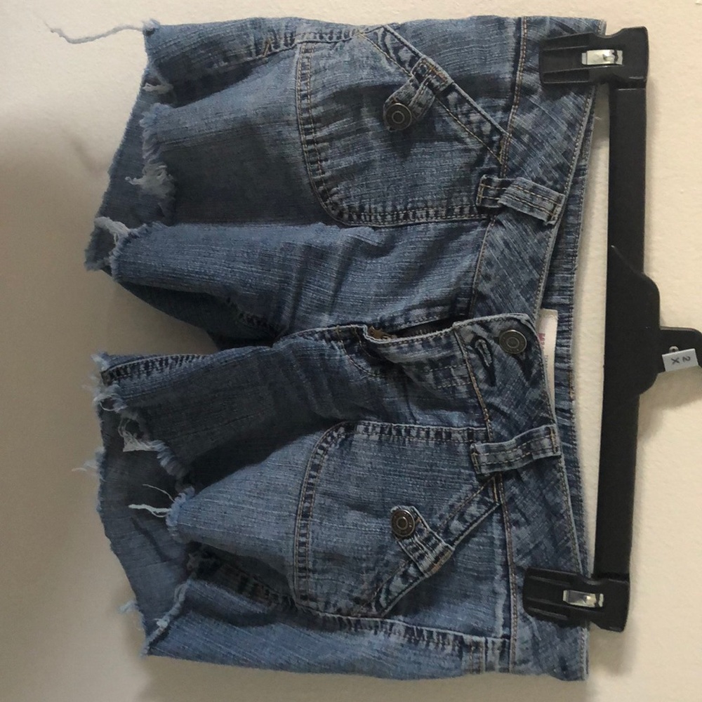 Altered distressed shorts